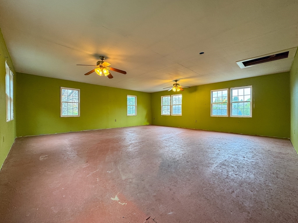 60 White Fox Road Feeding Hills, MA 01030 - Photo 24 of 29 a view of a big room with windows and fireplace