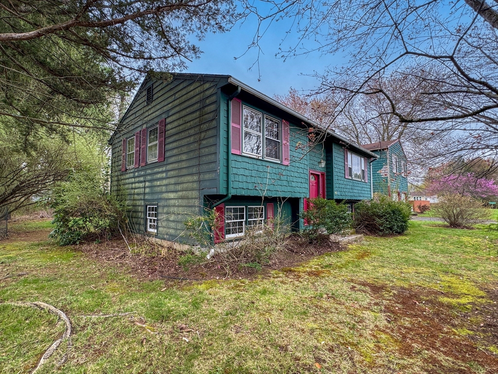 60 White Fox Road Feeding Hills, MA 01030 - Photo 3 of 29 a front view of a house with garden