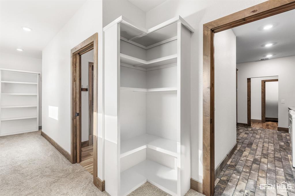 515 Sales Road Windthorst, TX 76389 - Photo 22 of 34 a view of a hallway with a wooden shelves