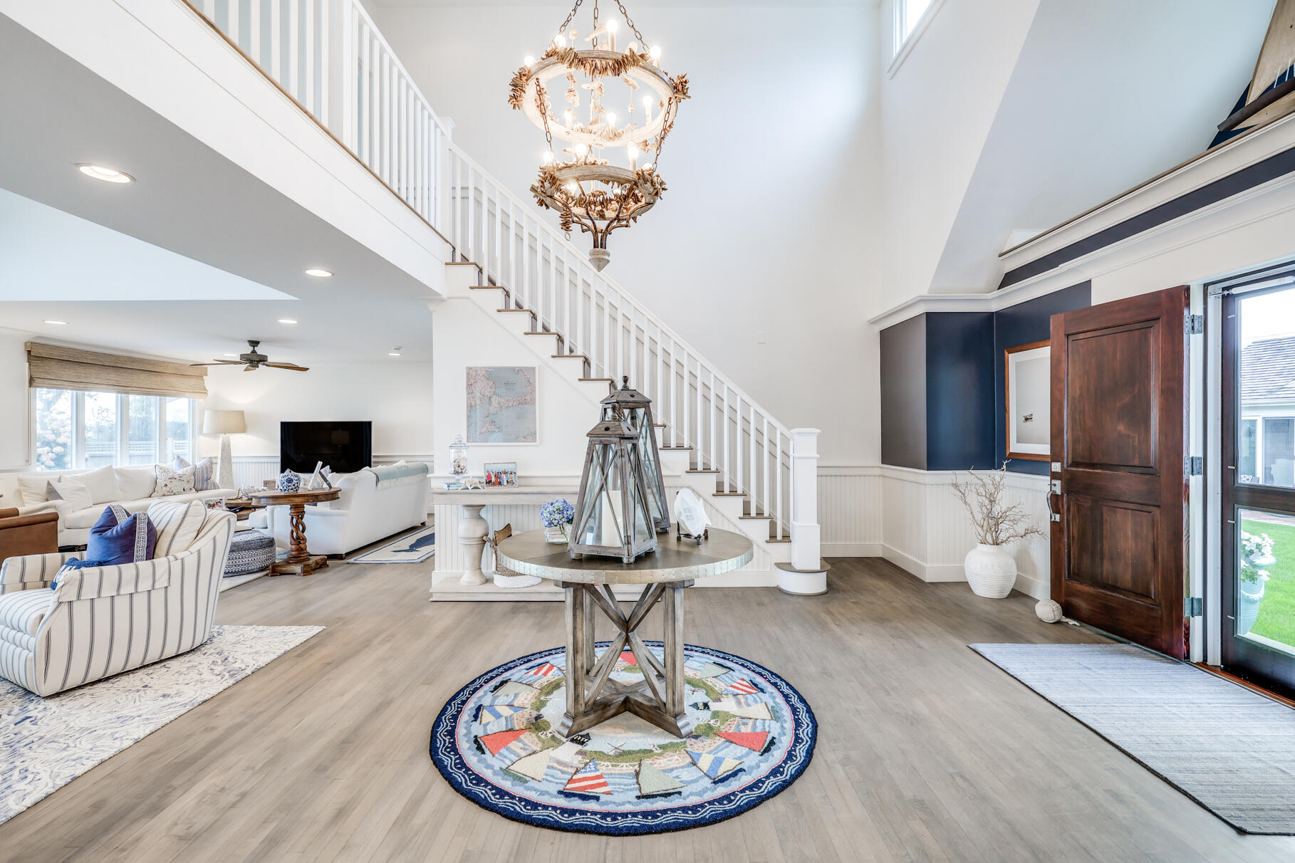 75 Shore Road West Harwich, MA 02671 - Photo 13 of 53 a living room with furniture and a chandelier