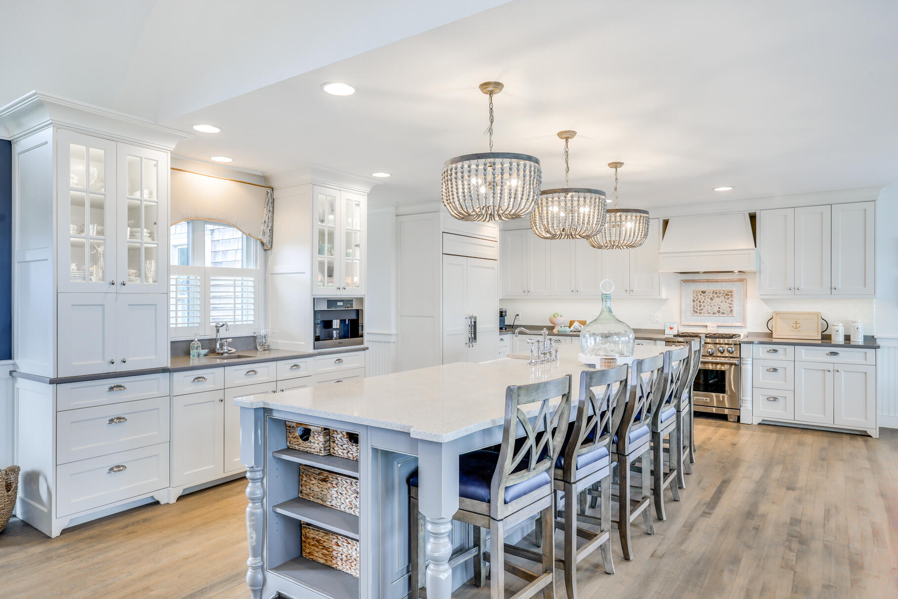 75 Shore Road West Harwich, MA 02671 - Photo 15 of 53 a kitchen with stainless steel appliances a table chairs and wooden floor