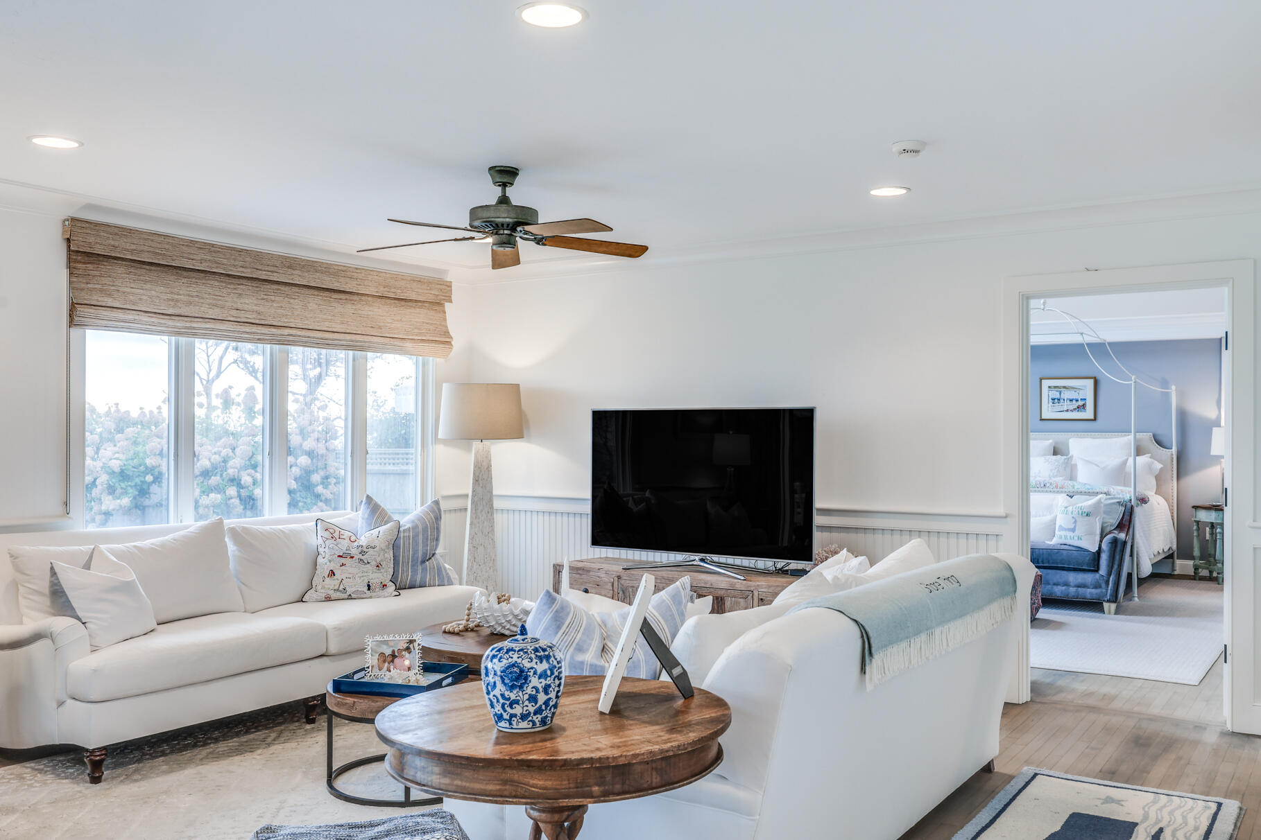 75 Shore Road West Harwich, MA 02671 - Photo 25 of 53 a living room with furniture a fireplace and a flat screen tv