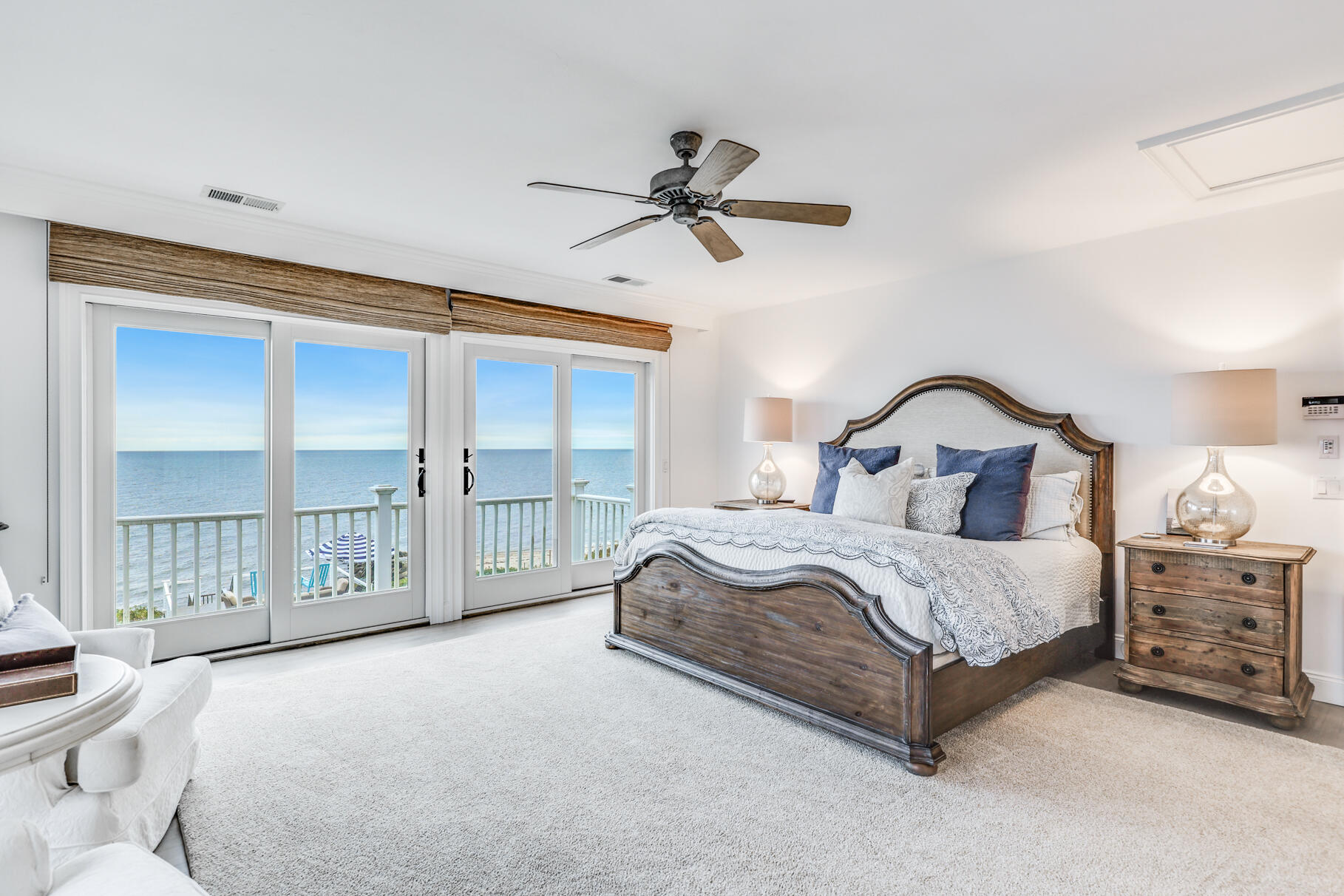 75 Shore Road West Harwich, MA 02671 - Photo 30 of 53 a bedroom with a large bed and a chandelier
