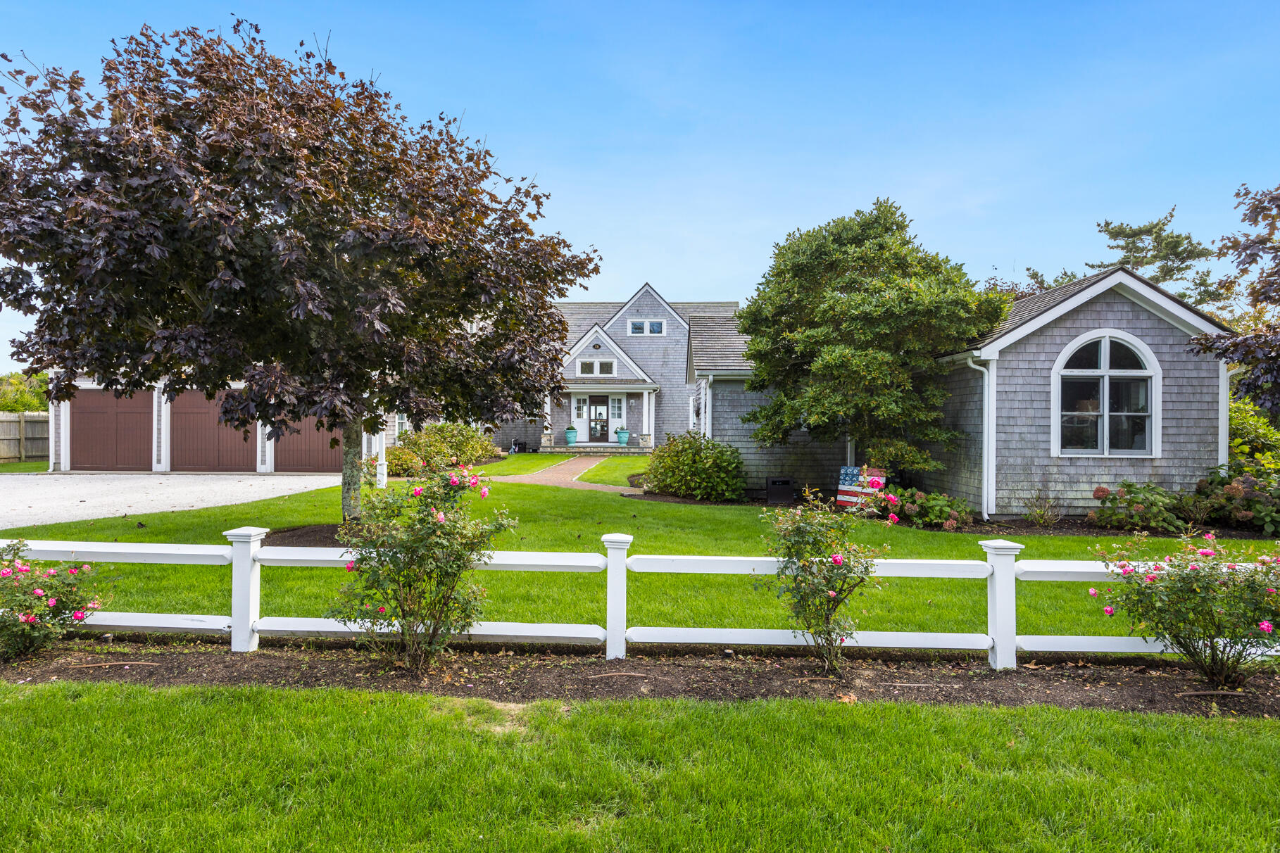75 Shore Road West Harwich, MA 02671 - Photo 45 of 53 a front view of a house with a yard and large trees