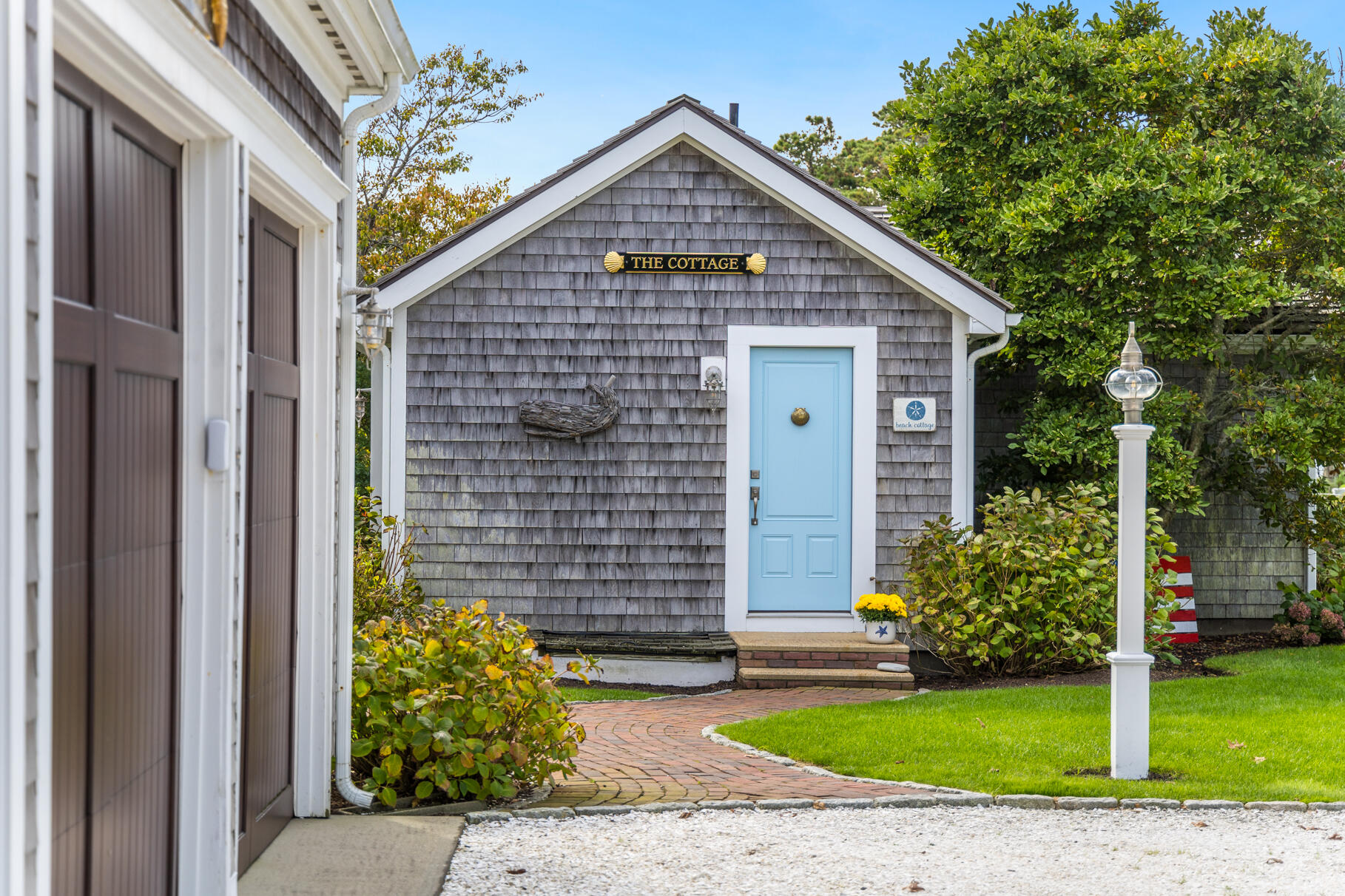 75 Shore Road West Harwich, MA 02671 - Photo 46 of 53 a front view of a house with garden