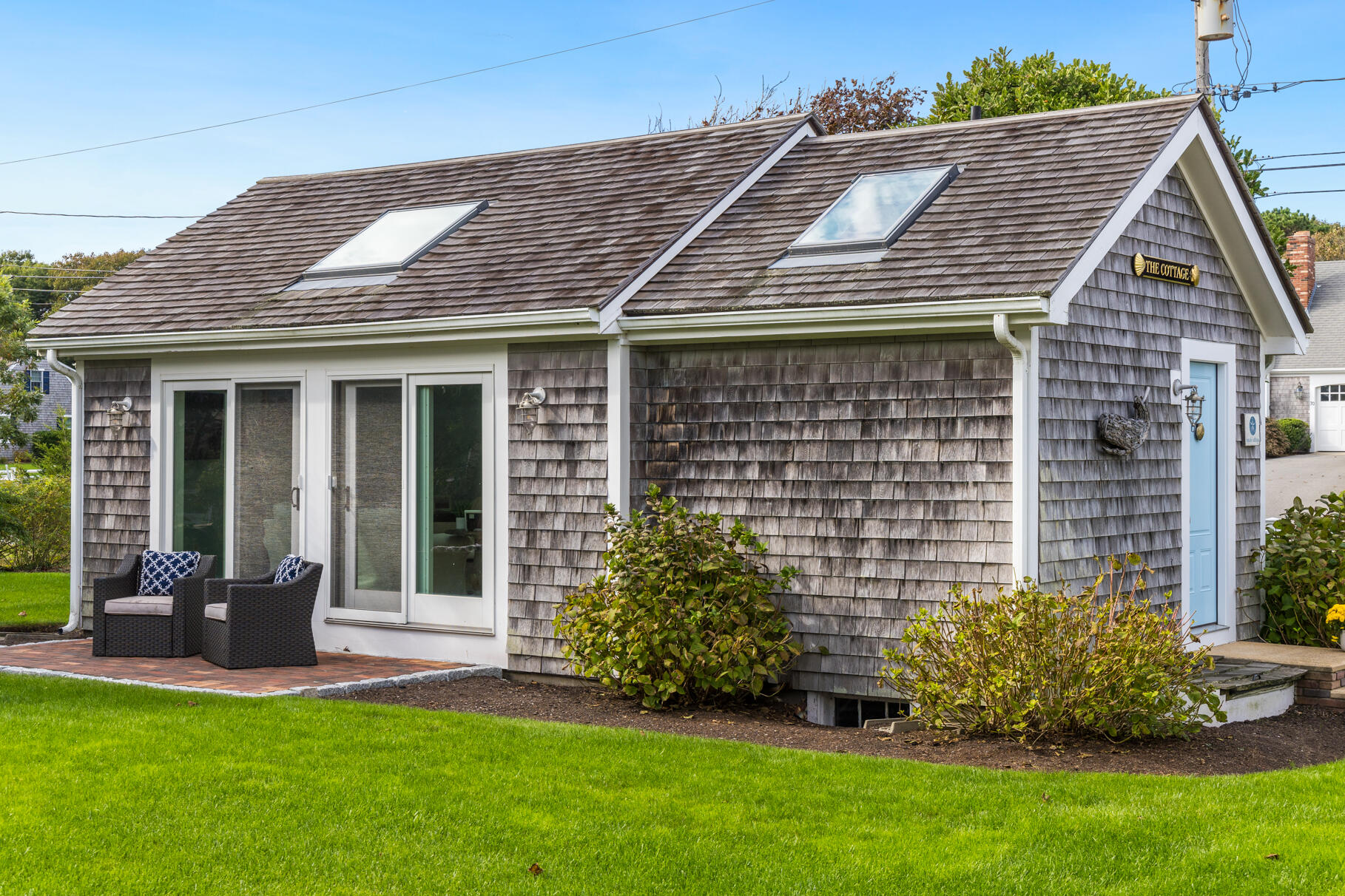 75 Shore Road West Harwich, MA 02671 - Photo 47 of 53 a front view of a house with a garden