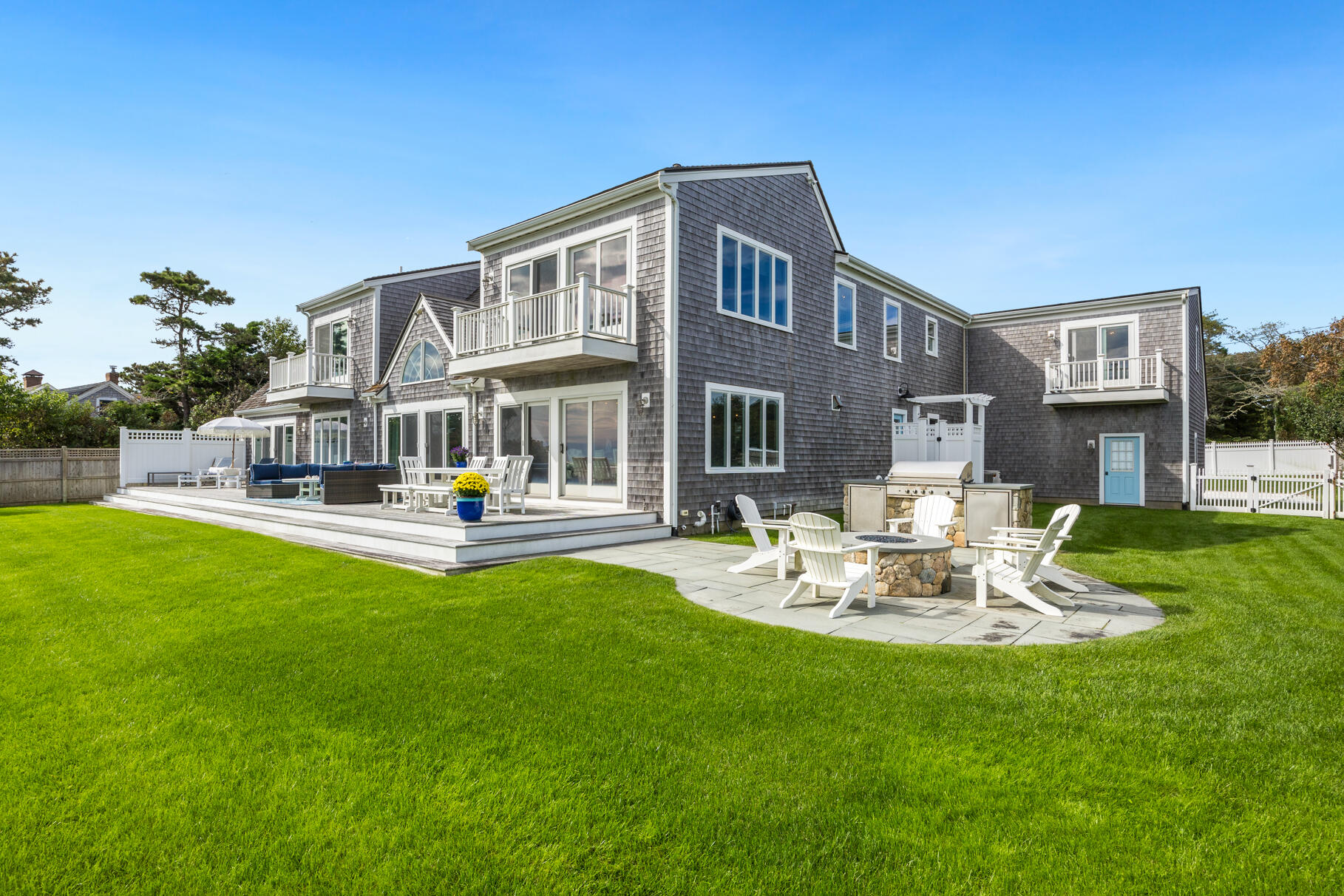75 Shore Road West Harwich, MA 02671 - Photo 6 of 53 a view of a house with sitting area and swimming pool