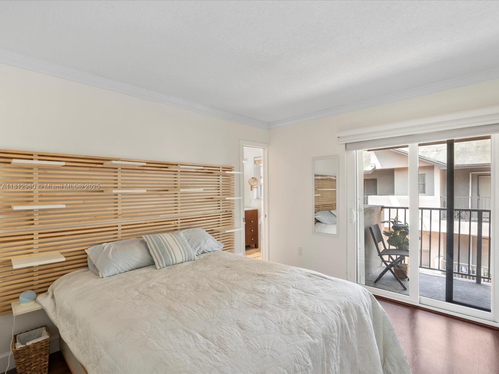 3097 Bird Avenue, Unit 3097 Miami, FL 33133 - Photo 14 of 29 a bedroom with a large bed and a large window