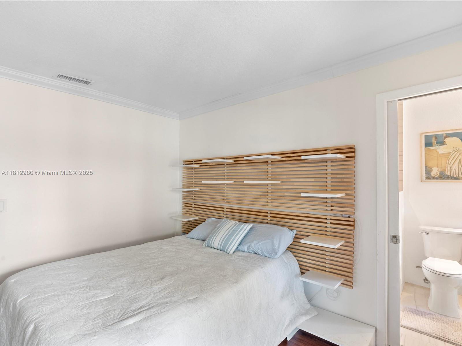 3097 Bird Avenue, Unit 3097 Miami, FL 33133 - Photo 15 of 29 a bedroom with a bed and a shower