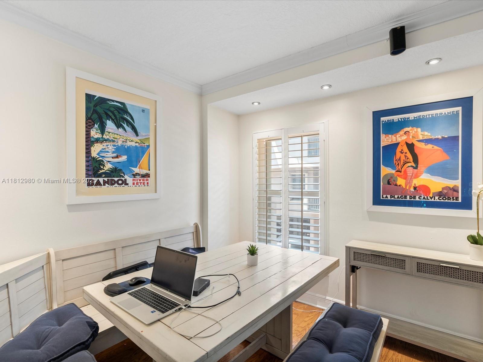 3097 Bird Avenue, Unit 3097 Miami, FL 33133 - Photo 5 of 29 a view of a workspace with furniture and window