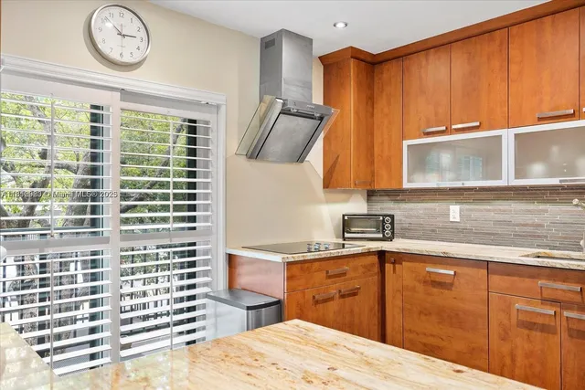 a kitchen with a sink and a window