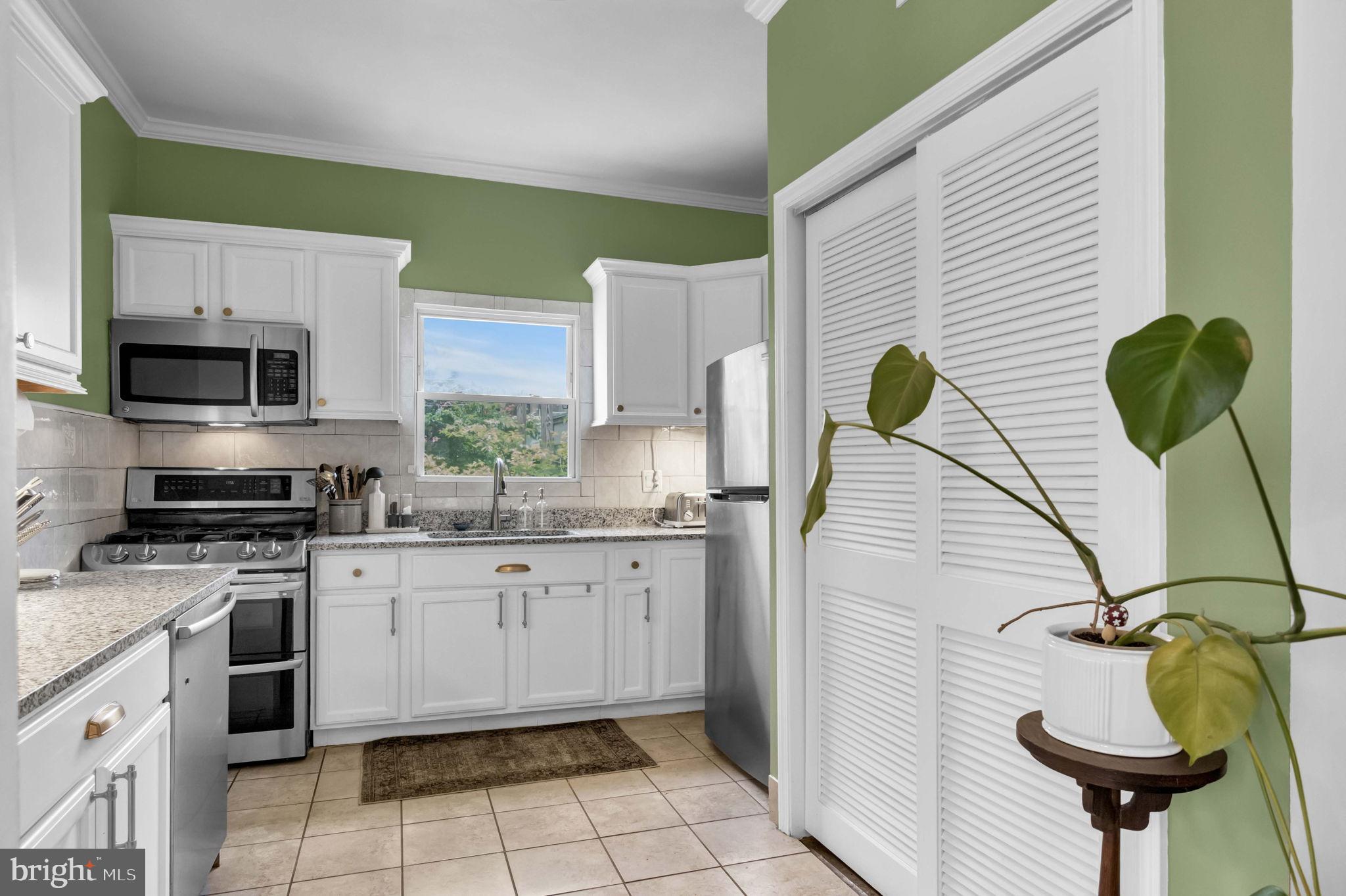 1526 Gales Street Northeast Washington, DC 20002 - Photo 12 of 35 Charming kitchen with vibrant green accents.