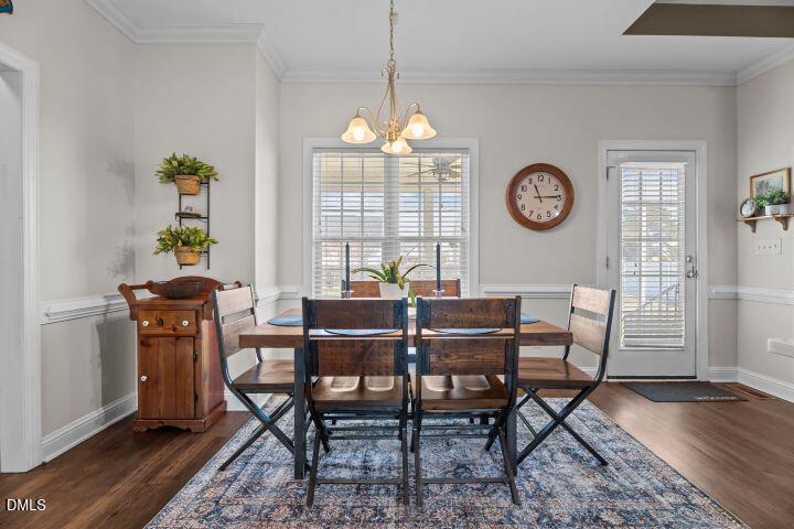 4240 Merck Road Wilson, NC 27893 - Photo 16 of 47 a view of a dining room with furniture window and wooden floor