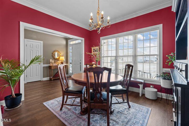 4240 Merck Road Wilson, NC 27893 - Photo 19 of 47 a view of a dining room with furniture and a chandelier