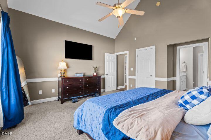 4240 Merck Road Wilson, NC 27893 - Photo 23 of 47 a bedroom with a bed and a flat screen tv