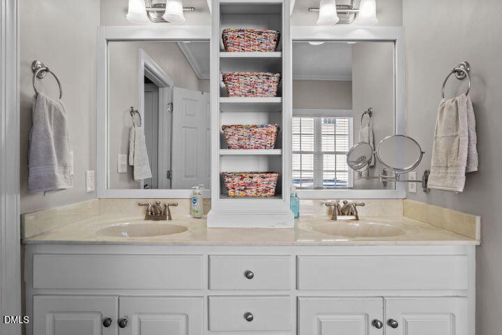 4240 Merck Road Wilson, NC 27893 - Photo 25 of 47 a bathroom with cabinets a sink and a mirror