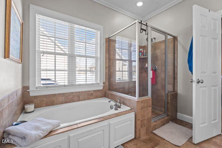 4240 Merck Road Wilson, NC 27893 - Photo 26 of 47 a spacious bathroom with a tub and shower