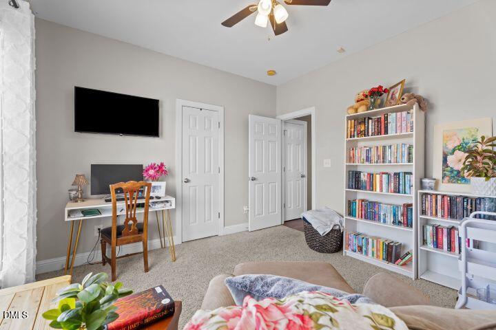 4240 Merck Road Wilson, NC 27893 - Photo 31 of 47 a bedroom with furniture and a book shelf