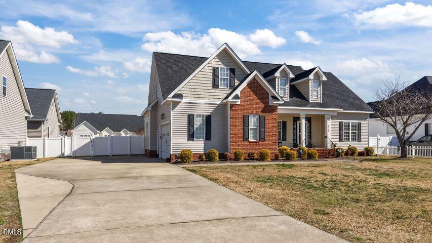 4240 Merck Road Wilson, NC 27893 - Photo 5 of 47 a front view of a house with a yard