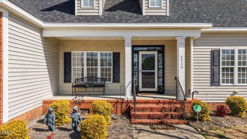 4240 Merck Road Wilson, NC 27893 - Photo 8 of 47 a front view of a house with large windows