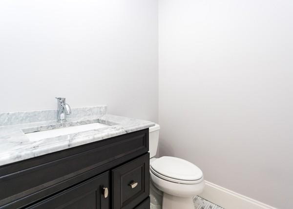 35 Sachem Road Needham, MA 02494 - Photo 12 of 21 a bathroom with a granite countertop toilet and a sink