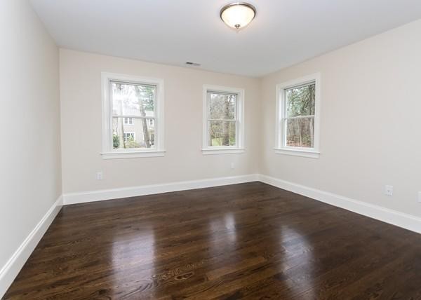 35 Sachem Road Needham, MA 02494 - Photo 13 of 21 a view of an empty room with wooden floor and a window