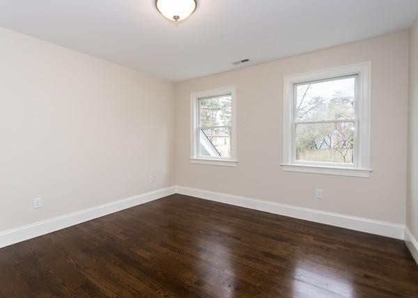 35 Sachem Road Needham, MA 02494 - Photo 14 of 21 a view of an empty room with wooden floor and a window