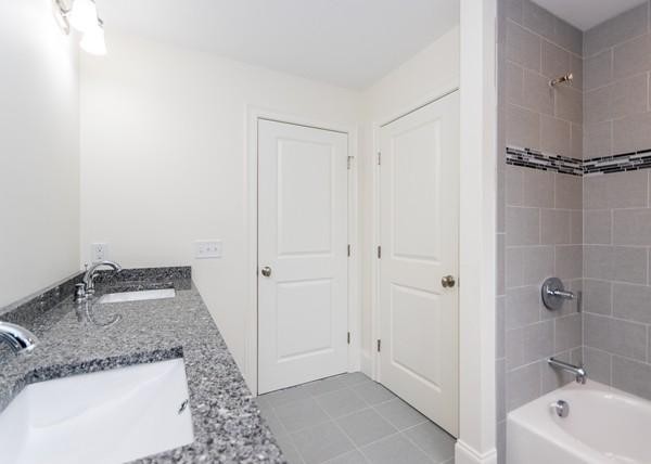35 Sachem Road Needham, MA 02494 - Photo 15 of 21 a bathroom with a granite countertop sink and shower