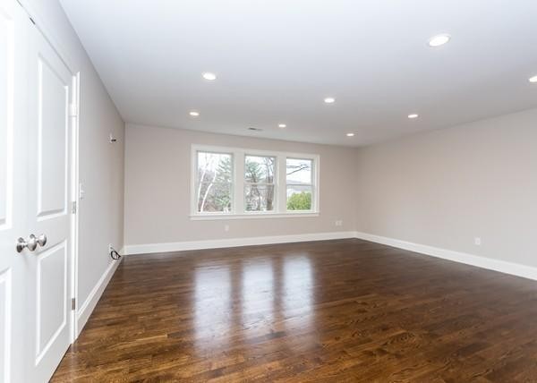 35 Sachem Road Needham, MA 02494 - Photo 17 of 21 a view of an empty room with wooden floor and a window