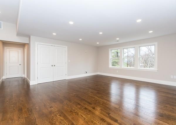 35 Sachem Road Needham, MA 02494 - Photo 18 of 21 an empty room with wooden floor and windows
