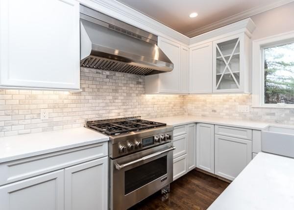 35 Sachem Road Needham, MA 02494 - Photo 4 of 21 a kitchen with stainless steel appliances granite countertop a stove and a sink