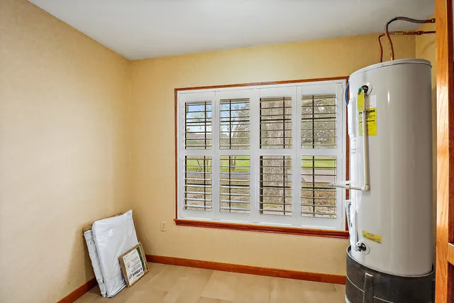 a view of wooden floor and chair in a room