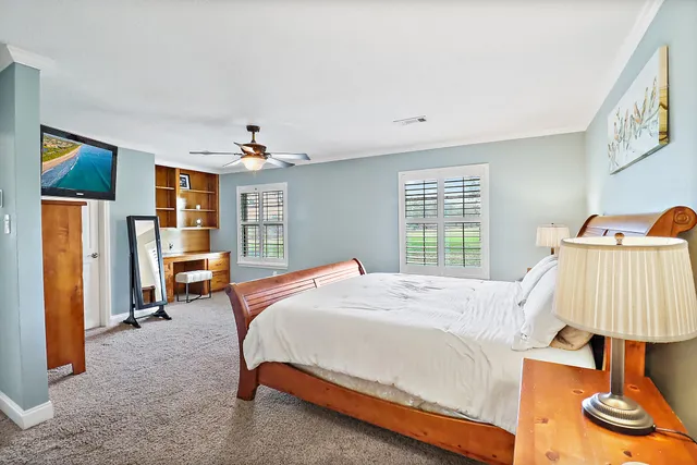 a bed room with a bed and a chair