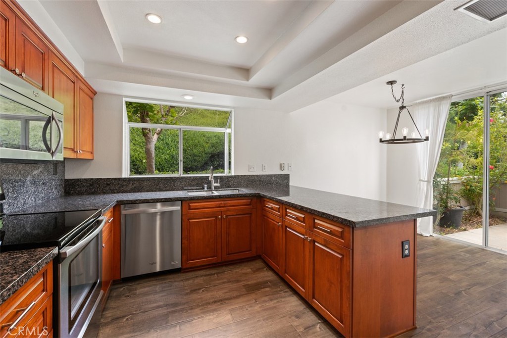 14 Pickney Close Laguna Niguel, CA 92677 - Photo 17 of 22 a kitchen with stainless steel appliances granite countertop a sink and a stove