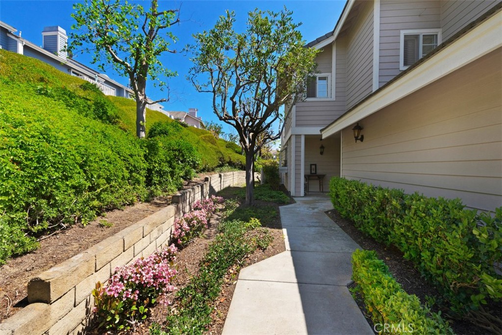 14 Pickney Close Laguna Niguel, CA 92677 - Photo 2 of 22 a view of a pathway with a flower garden