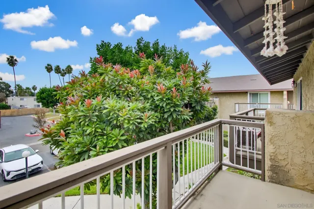 a view of a balcony with plants