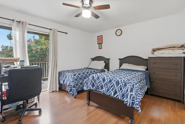 a bedroom with a bed and a desk