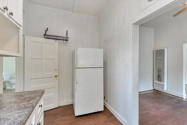 a view of a kitchen from the hallway