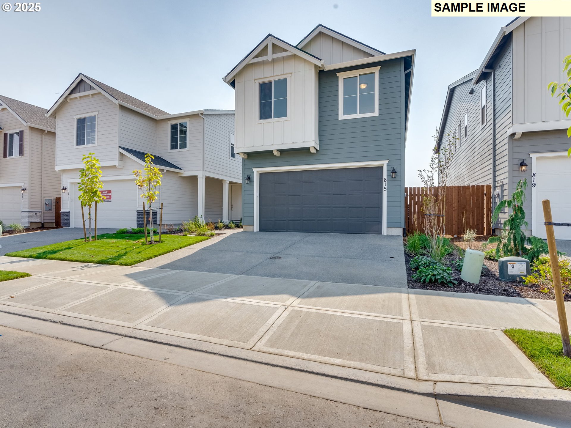 831 Northwest 178th Street Ridgefield, WA 98642 - Photo 12 of 37 a front view of a house with a yard and garage