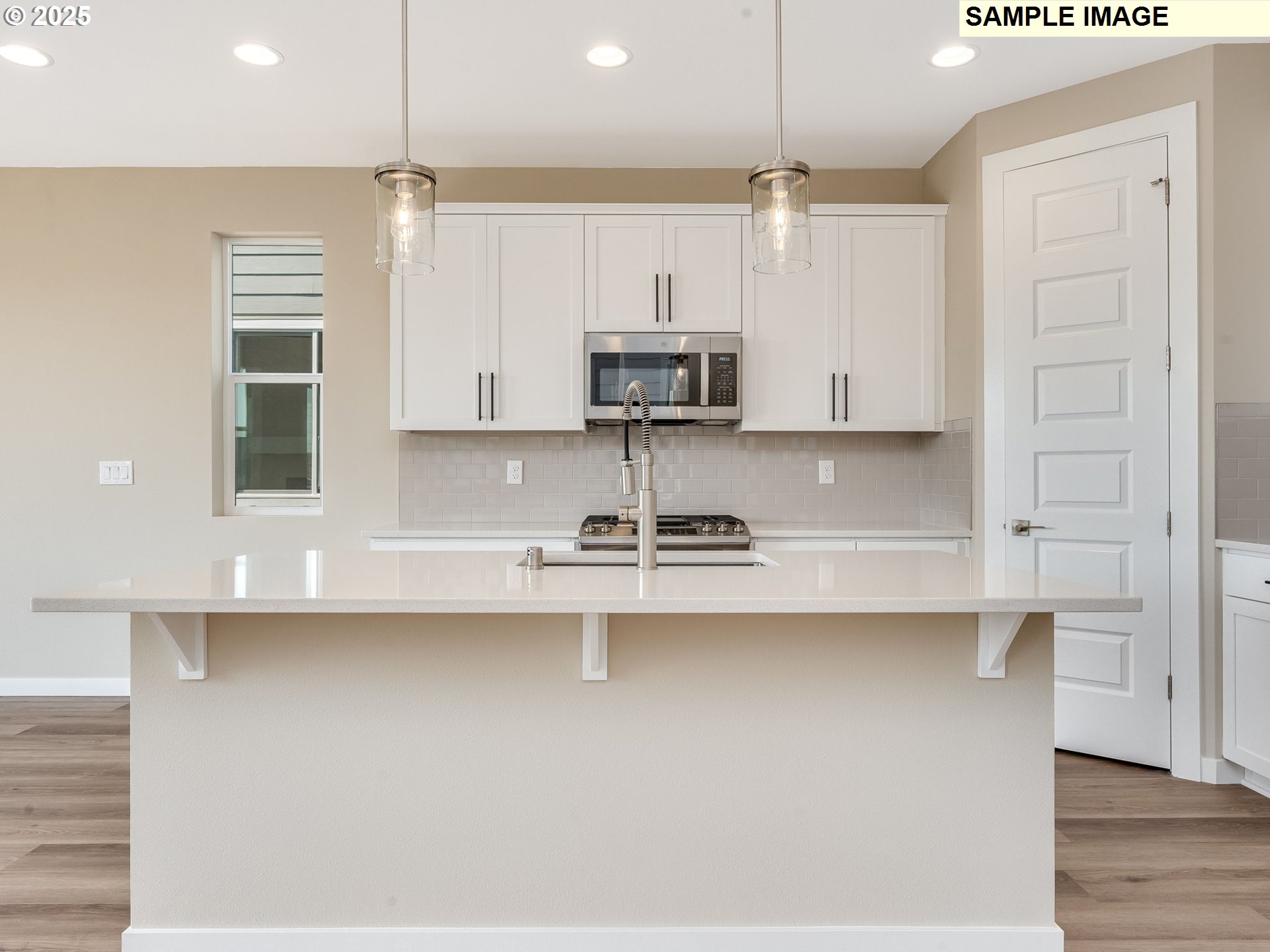 831 Northwest 178th Street Ridgefield, WA 98642 - Photo 2 of 37 a kitchen with kitchen island a sink stainless steel appliances and cabinets