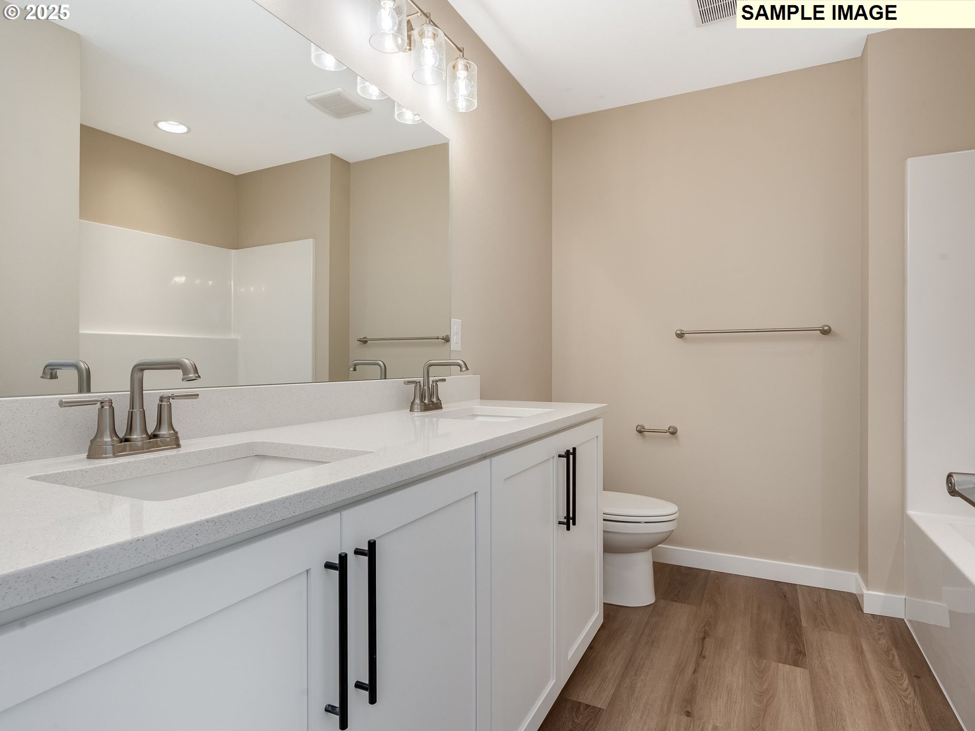 831 Northwest 178th Street Ridgefield, WA 98642 - Photo 26 of 37 a bathroom with a sink a toilet and a mirror
