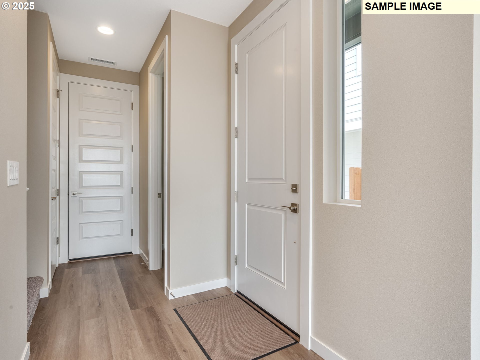 831 Northwest 178th Street Ridgefield, WA 98642 - Photo 36 of 37 a view of a hallway with wooden floor