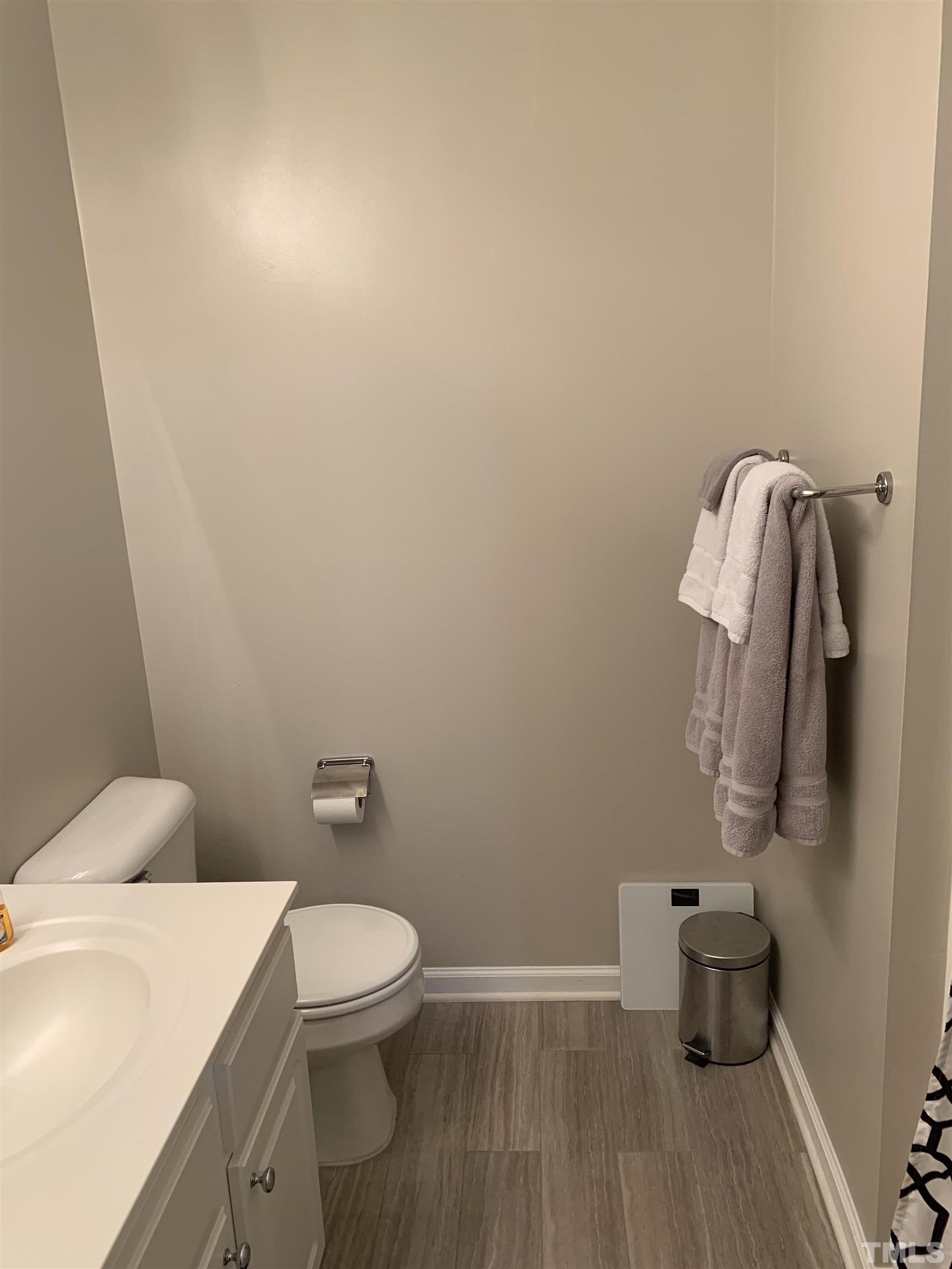 7845 Spungold Street Raleigh, NC 27617 - Photo 27 of 37 a bathroom with a toilet and a sink