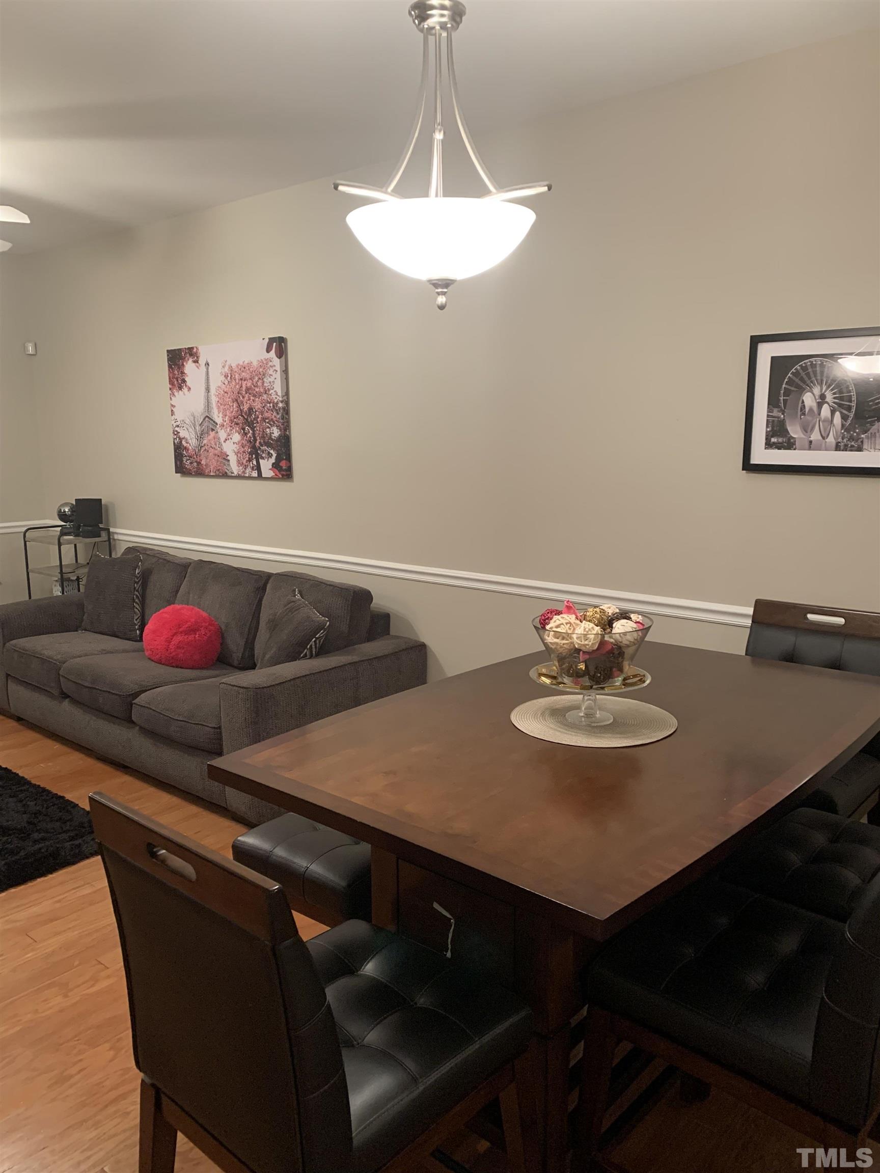 7845 Spungold Street Raleigh, NC 27617 - Photo 8 of 37 a view of a dining room with furniture
