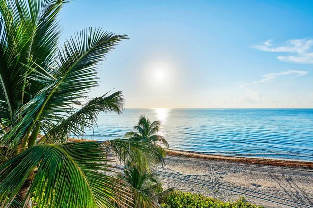 a living room with furniture fireplace and a large window