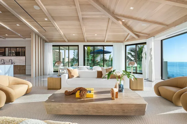 a bedroom with a large bed and a couch