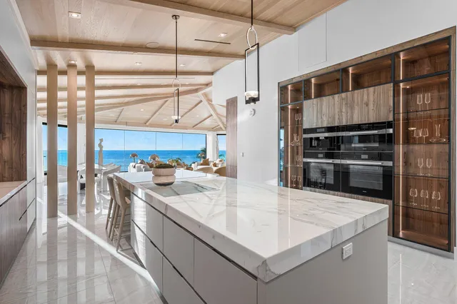 a living room with a rug and a chair