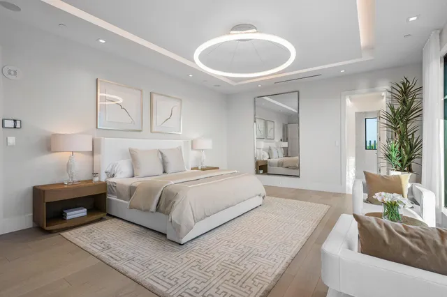 a spacious bedroom with a bed and a large window