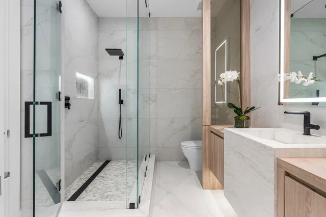 a living room with furniture and large windows