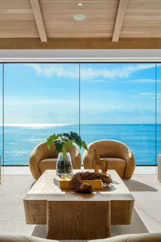 a kitchen with kitchen island a sink table and chairs